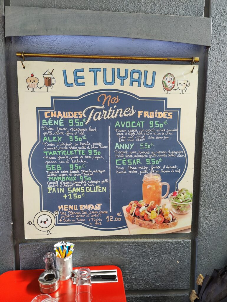 Menu board outside the restaurant Le Tuyau in Aix-en-Provence listing tartine specials of the day
